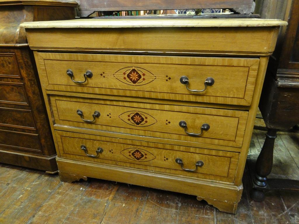 Appraisal: A th century stencilled pine chest fitted with three long