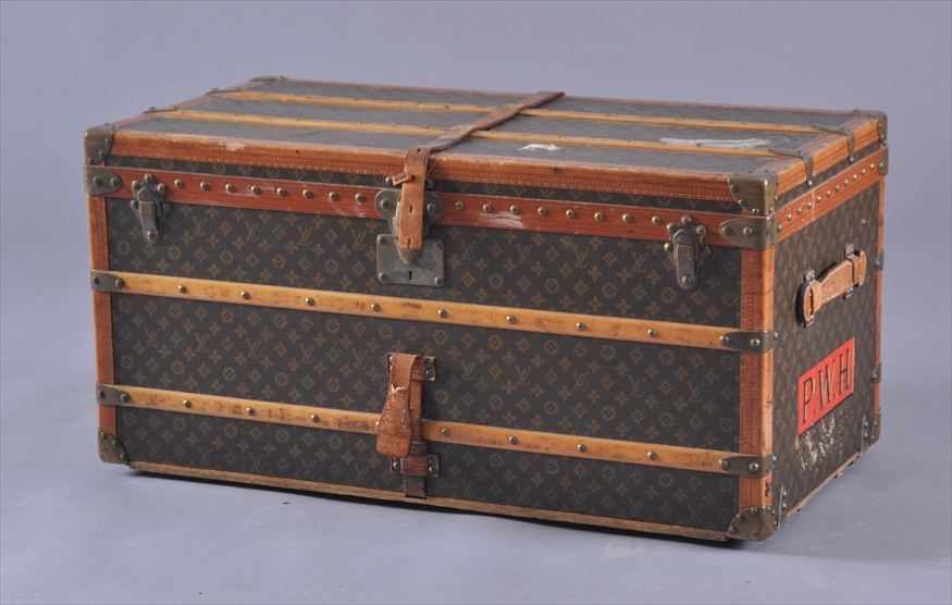 Appraisal: LOUIS VUITTON LEATHER-MOUNTED TRUNK The exterior with stamped leather edges