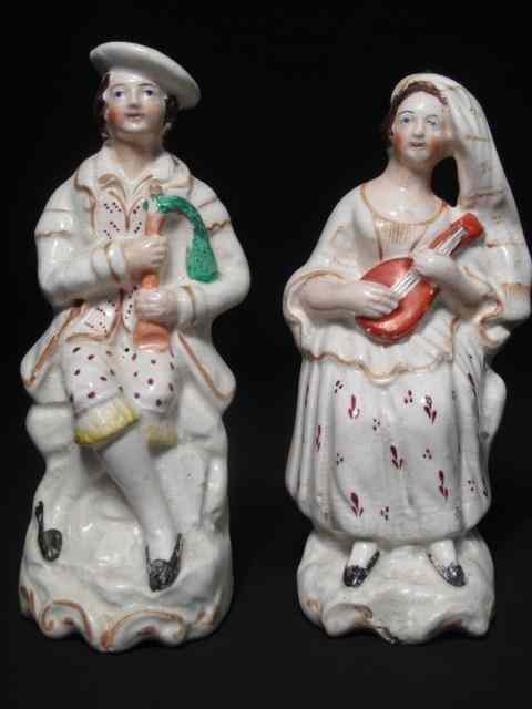 Appraisal: th century English Staffordshire figurines depicting a man and a