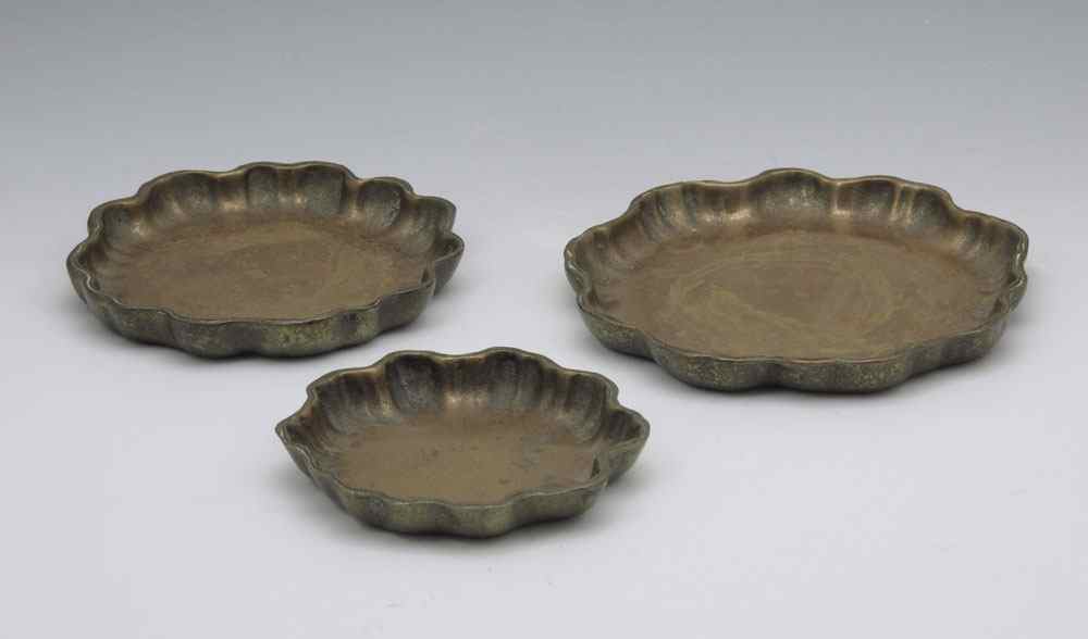 Appraisal: PIECE TIFFANY STUDIOS BRONZE TRAYS In graduated sizes from ''