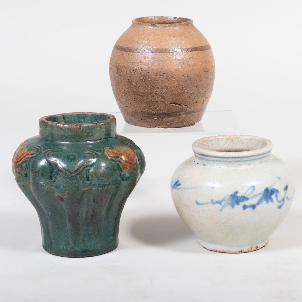 Appraisal: Three Asian Glazed Pottery Vases Comprising A lobed vase A