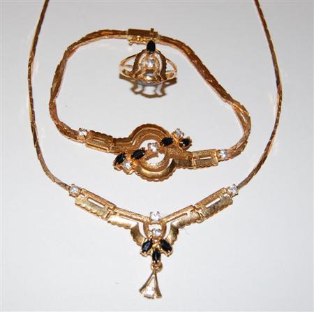 Appraisal: An Eastern gold and gem set suite comprising necklace bracelet