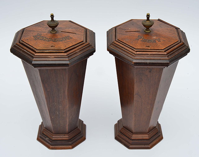 Appraisal: A PAIR OF EDWARDIAN MAHOGANY TAPERING OCTAGONAL MONEY BOXES each