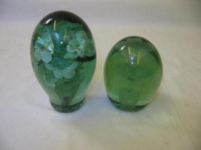 Appraisal: TWO GREEN GLASS DUMPS of tapering form each with flower