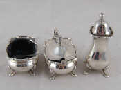 Appraisal: A three piece silver cruet comprising lidded mustard open salt