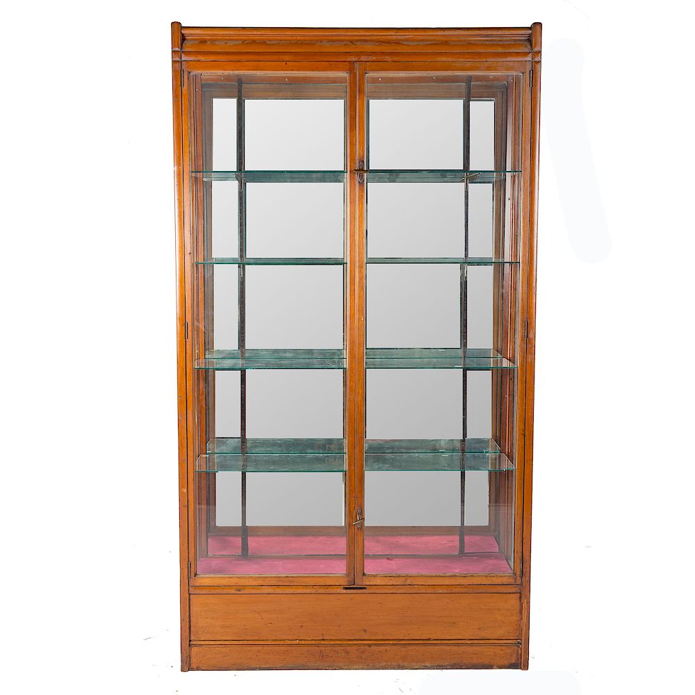 Appraisal: Edwardian walnut glass display cabinet metal label POLLARDS Storefitters London