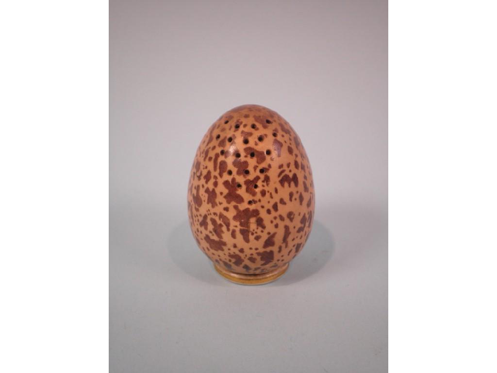 Appraisal: A McIntyre pepper pot in the form of a speckled