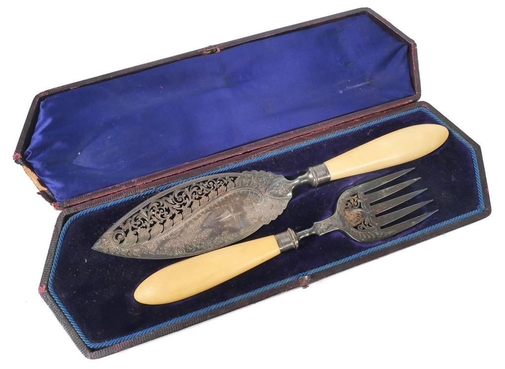 Appraisal: English fish serving set with ivory handles The slice blade