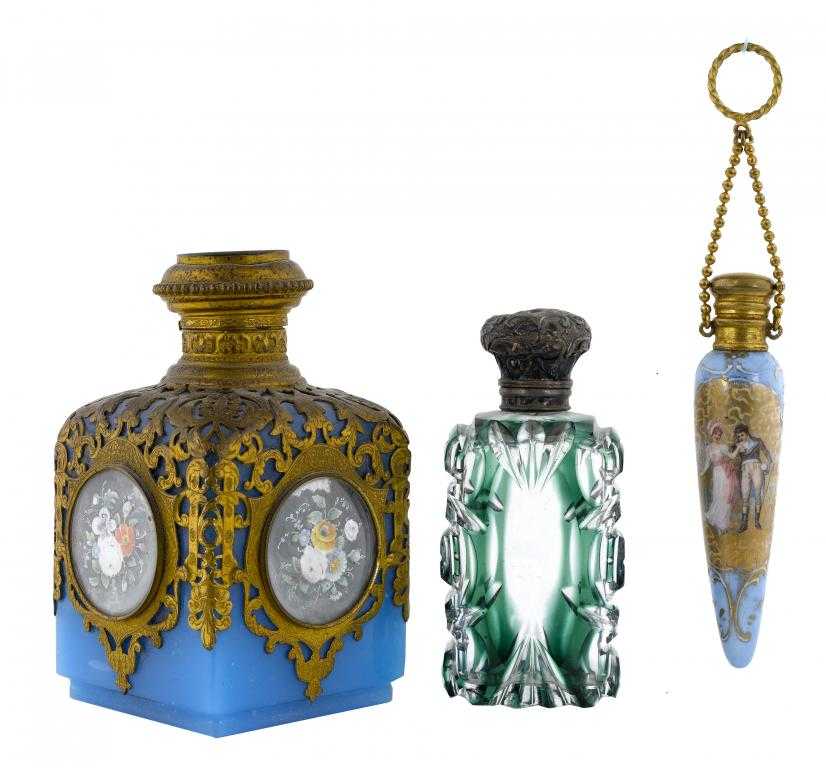 Appraisal: THREE GLASS SCENT BOTTLES comprising a Victorian silver-mounted green flashed