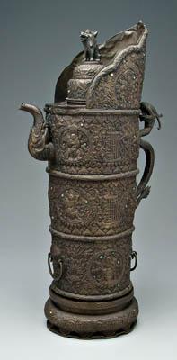 Appraisal: Tibetan bronze ewer columnar monk s cap style banded with