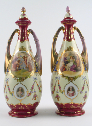 Appraisal: PAIR OF ROYAL VIENNA PORCELAIN COVERED URNS having hand painted