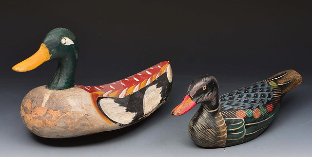 Appraisal: A PAINTED DECOY DUCK cm long and another smaller