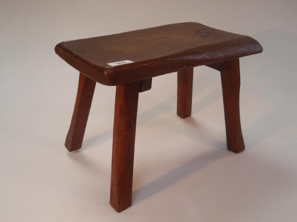 Appraisal: A rustic oak stool with Thebes style legs