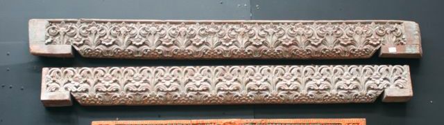 Appraisal: A pair of polychrome panels intricately carved with flower and