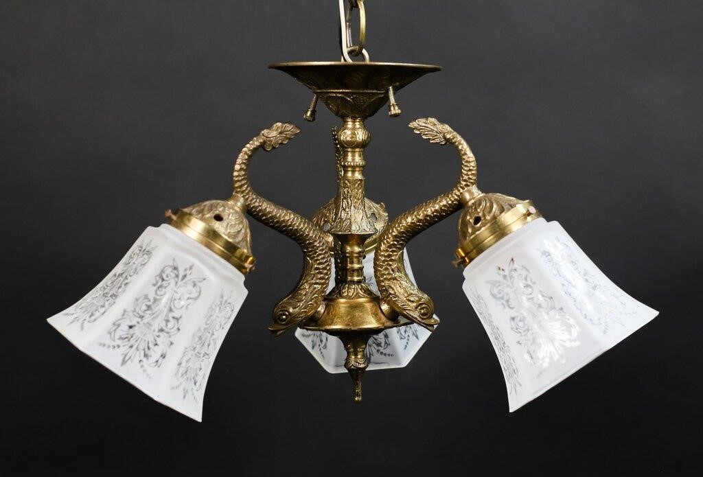 Appraisal: Bronze light chandelier dolphin form arms and etched glass shades