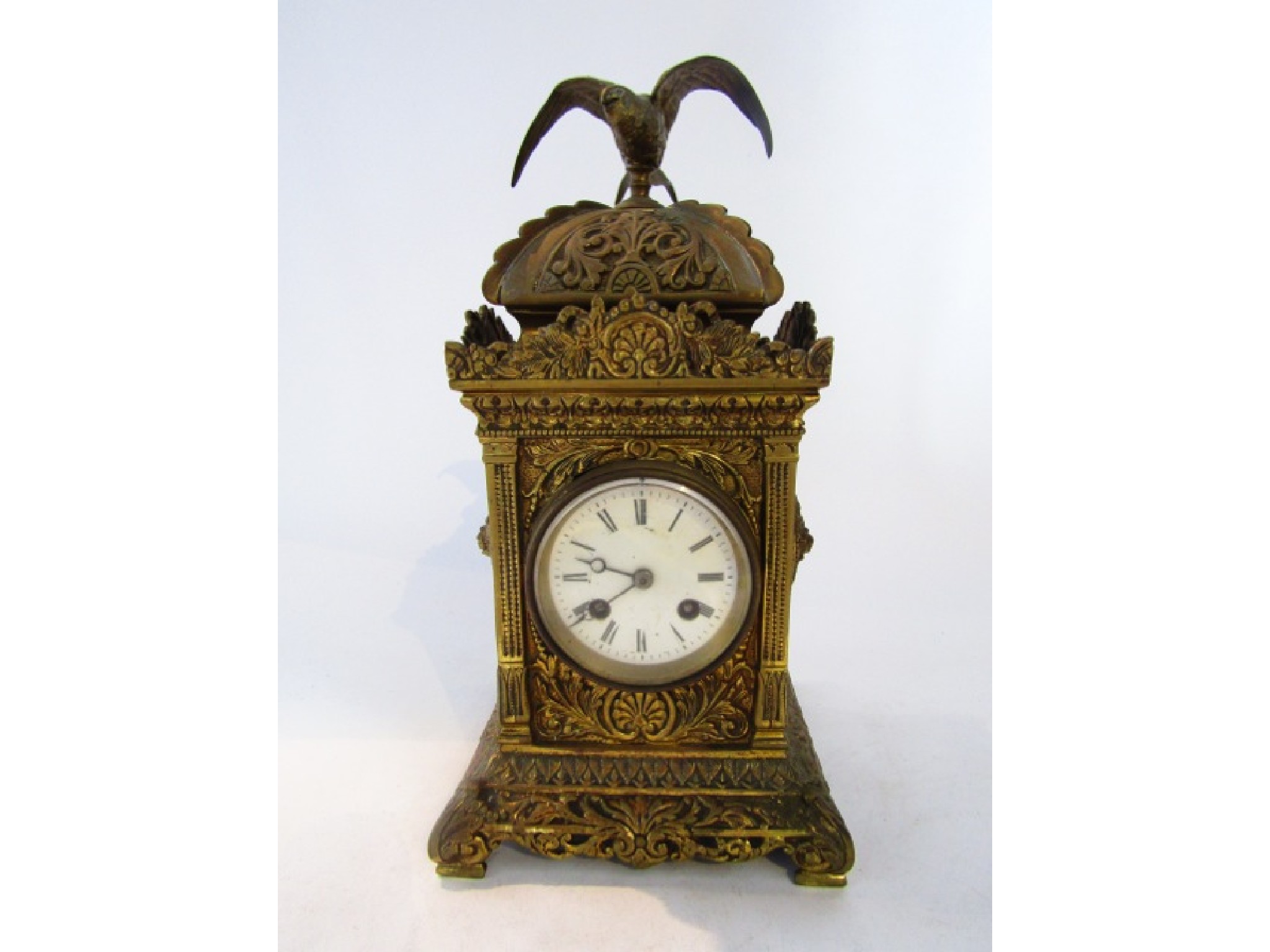 Appraisal: A Victorian cast brass mantel clock the square cut case