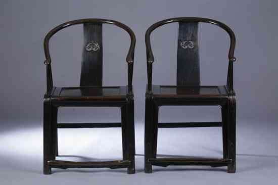 Appraisal: PAIR CHINESE LACQUERED ELMWOOD HORSE SHOE BACK ARM CHAIRS th