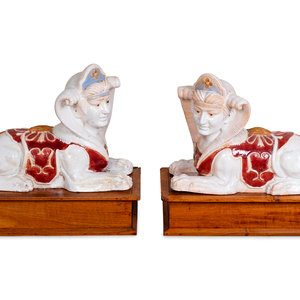 Appraisal: A Pair of Polychromed Ceramic Sphinxes TH CENTURY Each crackle-glazed