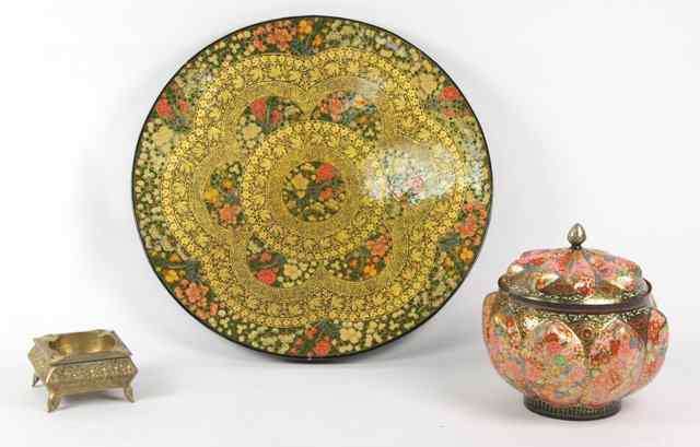 Appraisal: An Indian brass ashtray on leaf moulded feet a lacquered