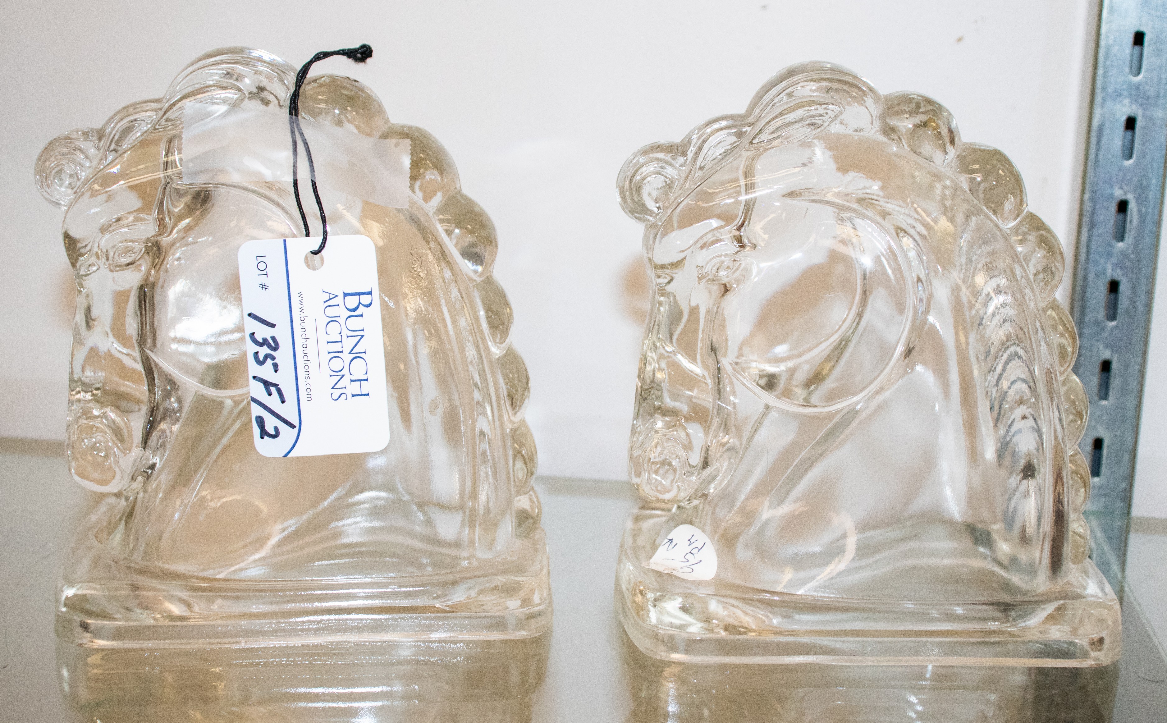 Appraisal: Pair of glass horse head bookends - h