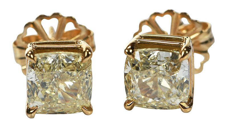 Appraisal: tcw Natural Yellow Diamond Earrings each with one cushion modified