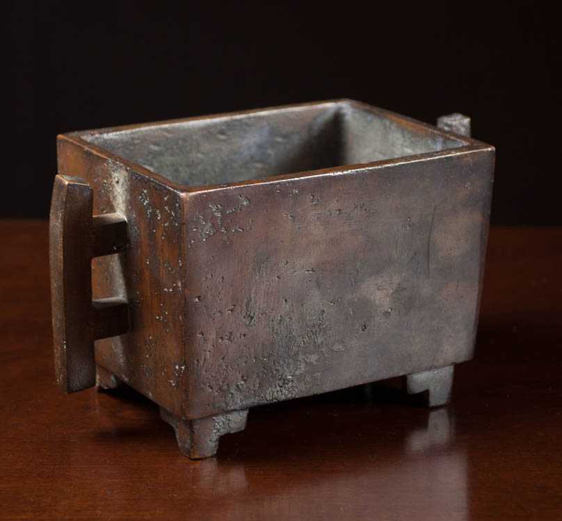 Appraisal: CHINESE PATINATED BRONZE CENSOR footed and handled with low profile