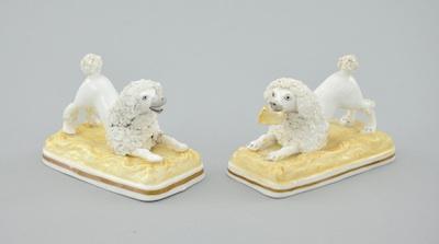 Appraisal: A Pair of Staffordshire Porcelain Poodle Figures on Cushions Each