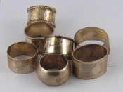 Appraisal: Silver Two heavy pairs of napkin rings together with three