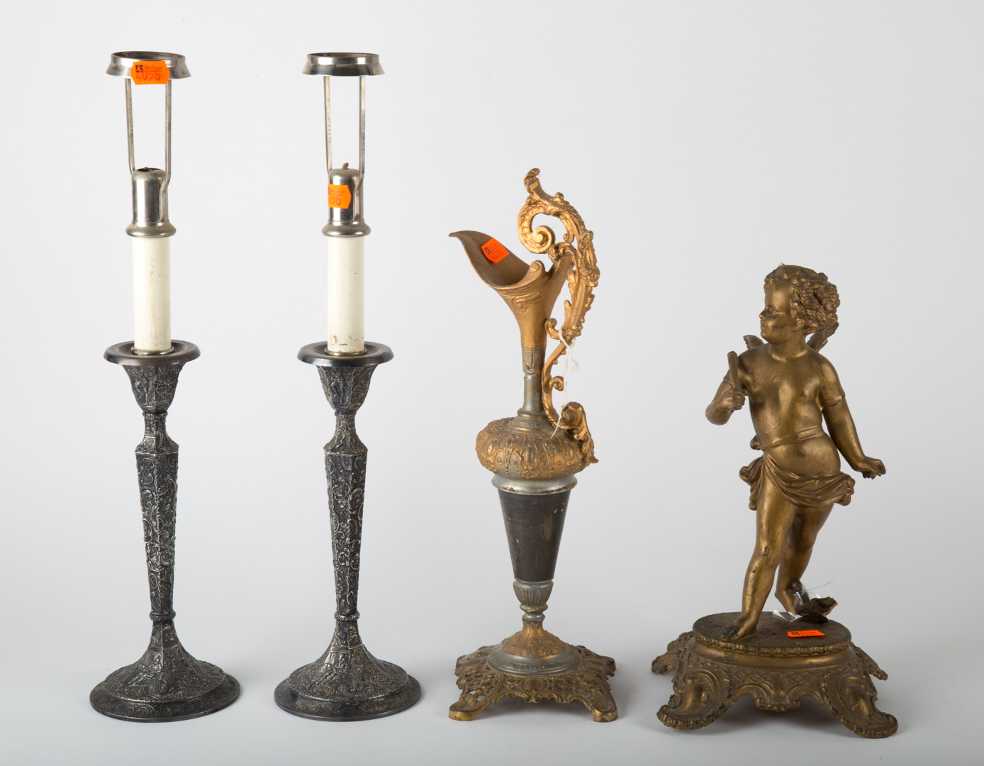 Appraisal: Four decorative items including two candlesticks cherub figure and a