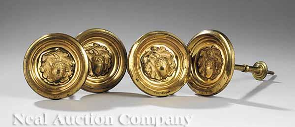 Appraisal: A Set of Four American Classical Pressed Brass Tie Backs