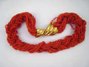 Appraisal: A coral bead necklace with a yellow metal tests carat