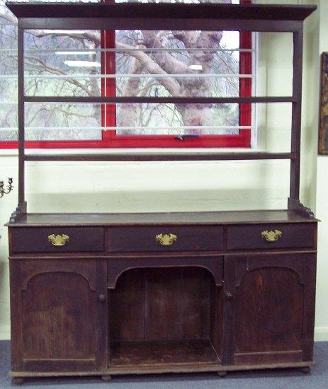 Appraisal: A th Century oak dresser the open rack to a