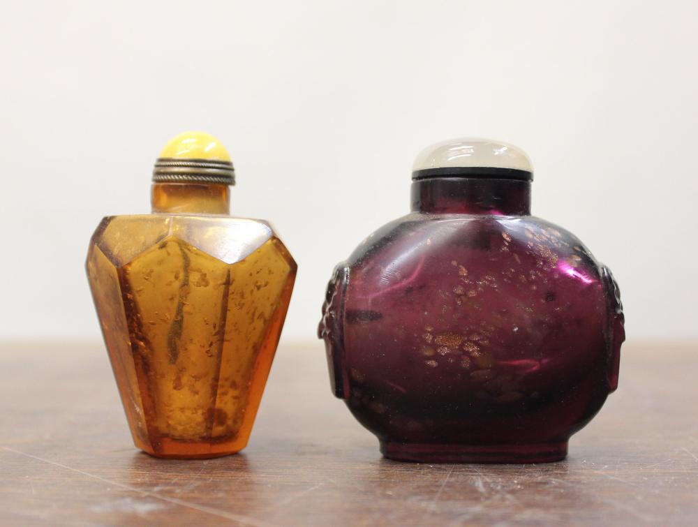 Appraisal: TWO CHINESE GOLD FLECKED GLASS SNUFF BOTTLES a faceted amber