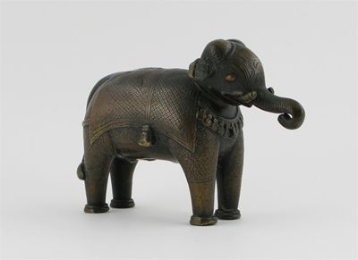 Appraisal: A small Indian bronze model of a caprisoned elephant standing