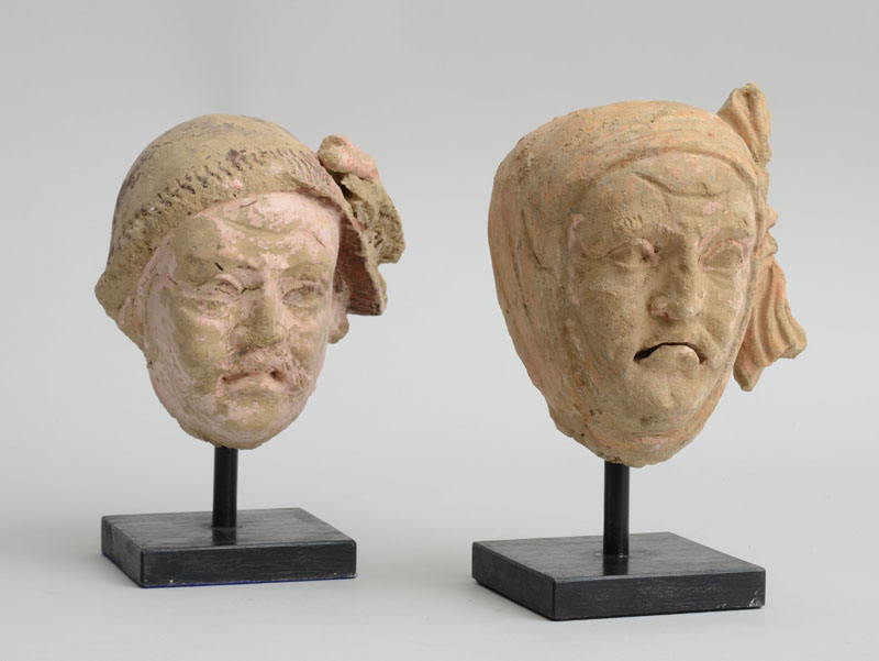 Appraisal: TWO GANDHARAN POLYCHROME HEADS OF MOURNERS Possibly th- th century