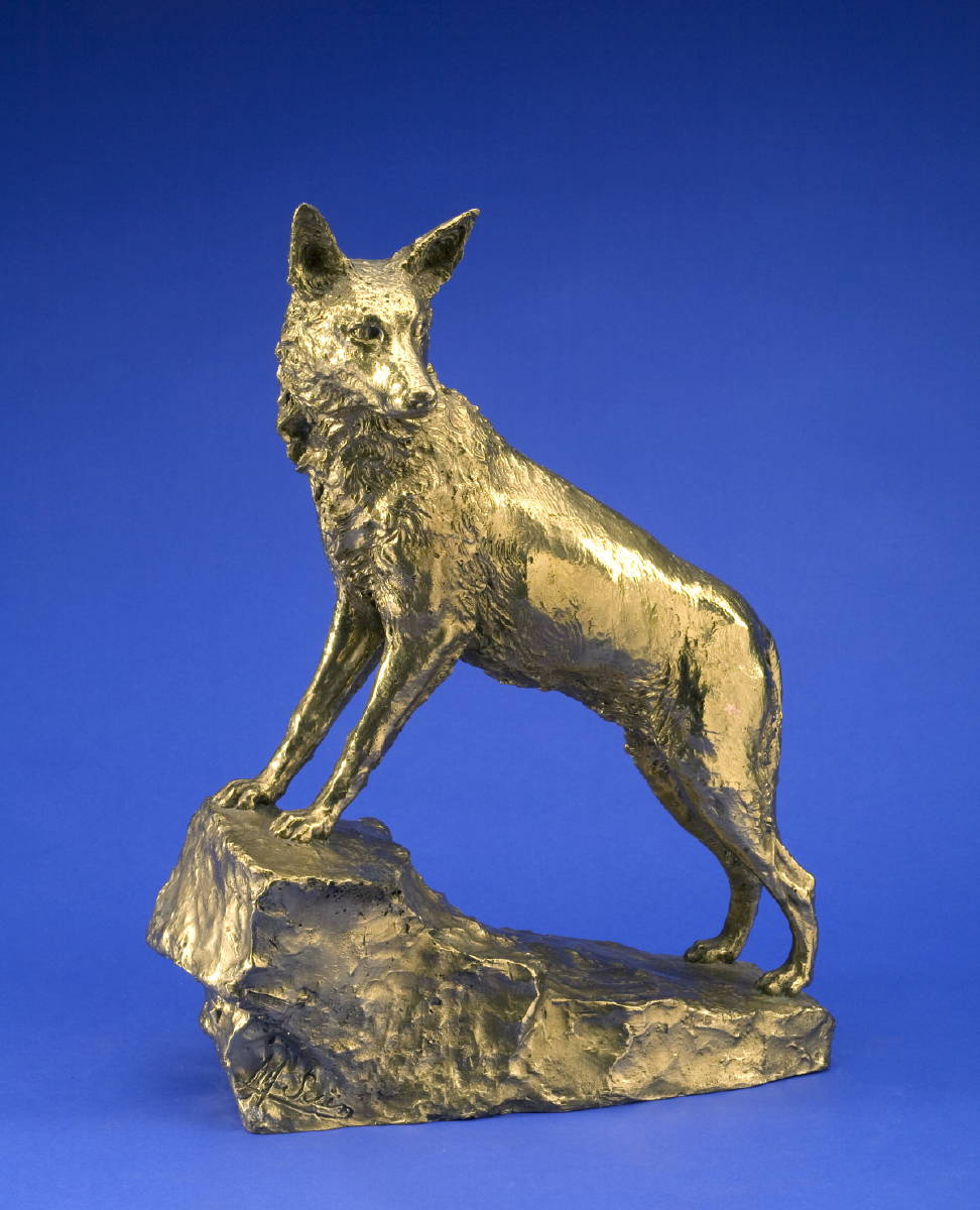 Appraisal: GOLD-PATINATED BRONZE FIGURE OF A WOLF STANDING ON A ROCK