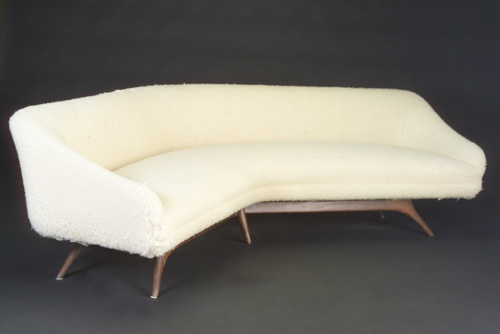 Appraisal: VLADIMIR KAGAN Wide-angle sofa with sloping armrests covered in ivory