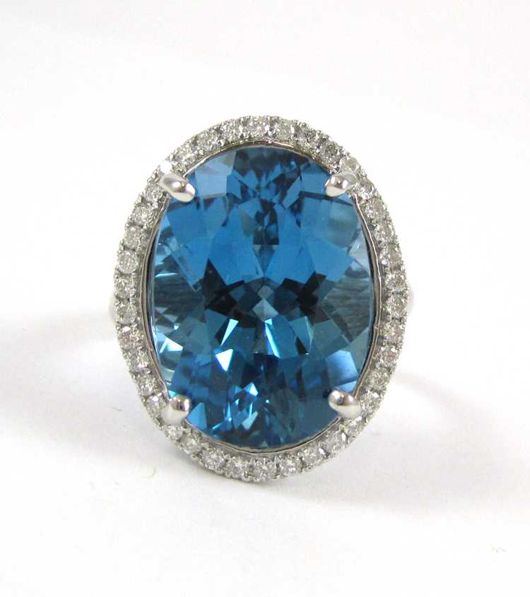 Appraisal: BLUE TOPAZ DIAMOND AND FOURTEEN KARAT GOLD RING The white