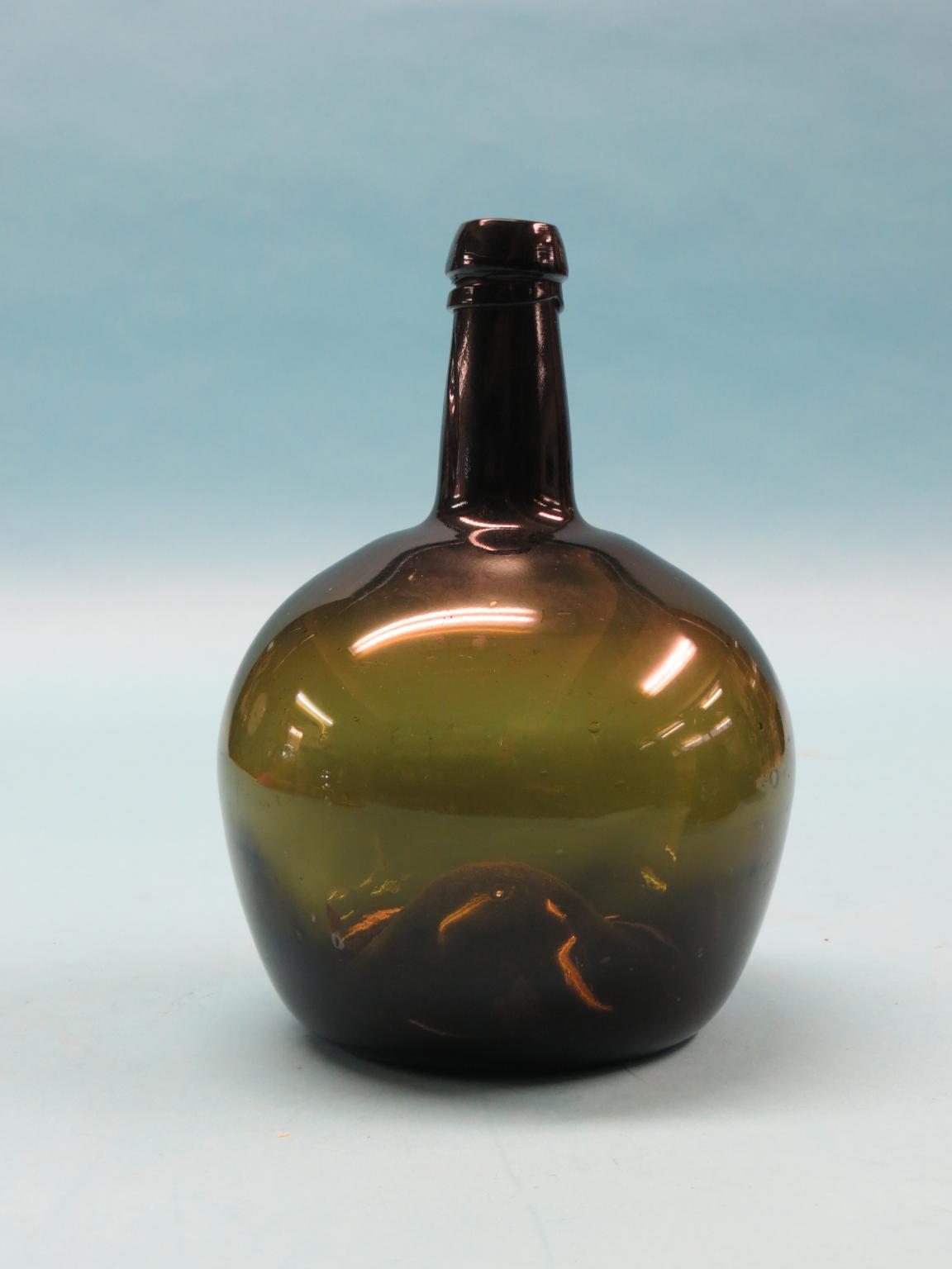 Appraisal: An early George III glass wine bottle large-compacity deep-green with