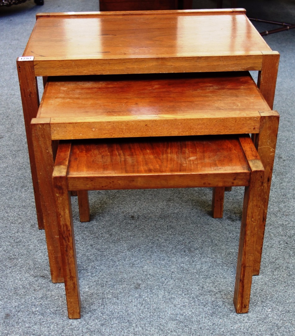 Appraisal: A nest of three th century teak occasional tables by