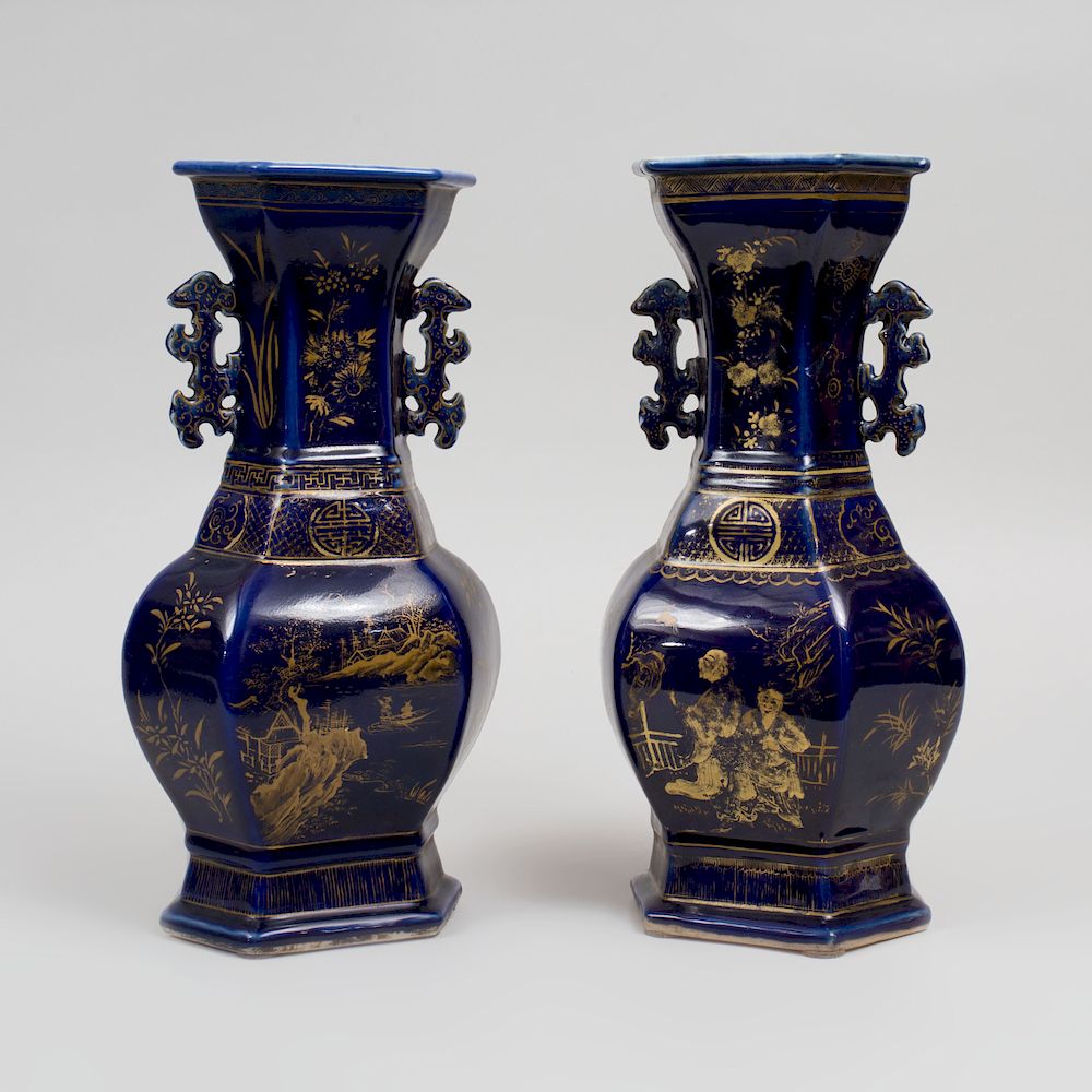 Appraisal: Pair of Chinese Porcelain Gilt-Decorated Cobalt Ground Faceted Baluster Vases