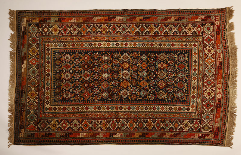 Appraisal: A Caucasian Chi-Chi woolen carpet rug A Caucasian Chi-Chi woolen