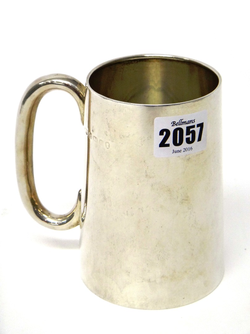 Appraisal: A silver mug of tapering cylindrical form with a C