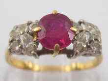 Appraisal: A ruby and diamond ring the central ruby measuring approx