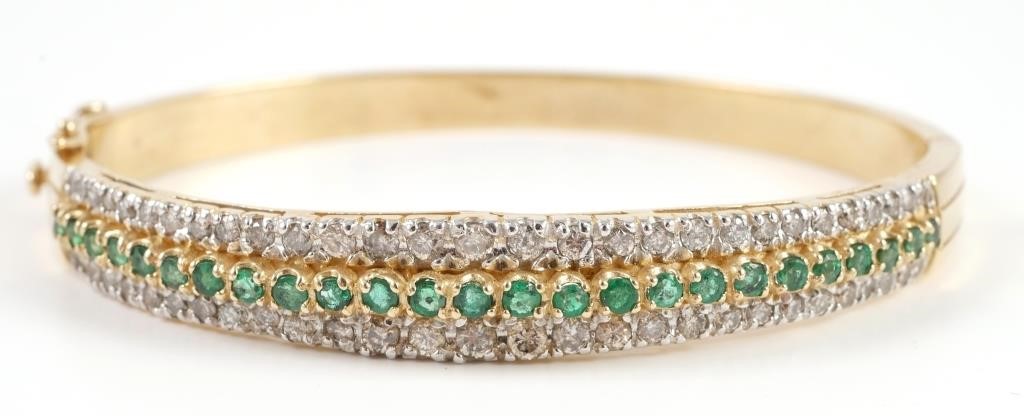 Appraisal: K yellow gold bangle bracelet contains round brilliant cut diamonds