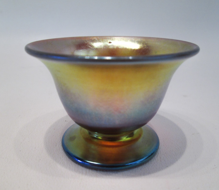 Appraisal: STEUBEN AURENE FOOTED ART GLASS SALT gold iridescent with flared