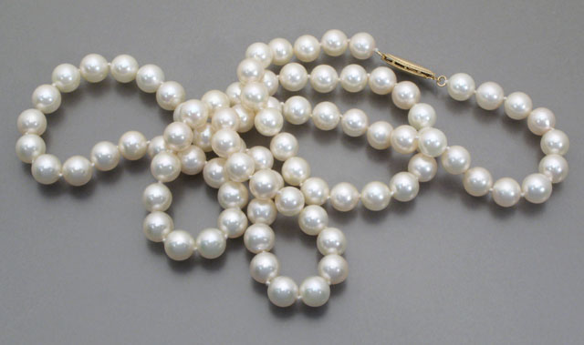 Appraisal: OPERA LENGTH PEARL NECKLACE strung with round white pearls -