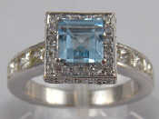 Appraisal: A white metal tests carat gold aquamarine and diamond ring