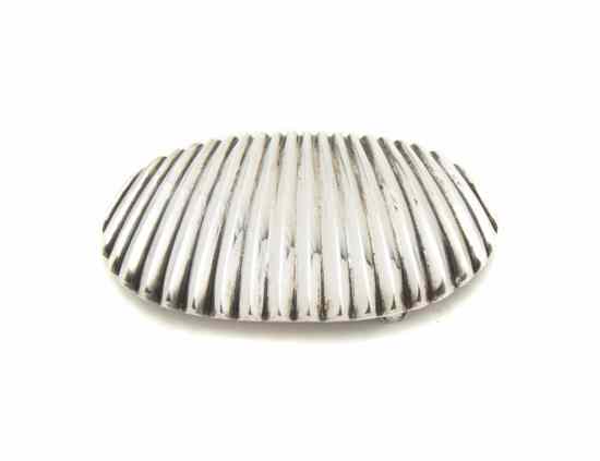 Appraisal: A Navajo Sterling Silver Belt Buckle in a shell design