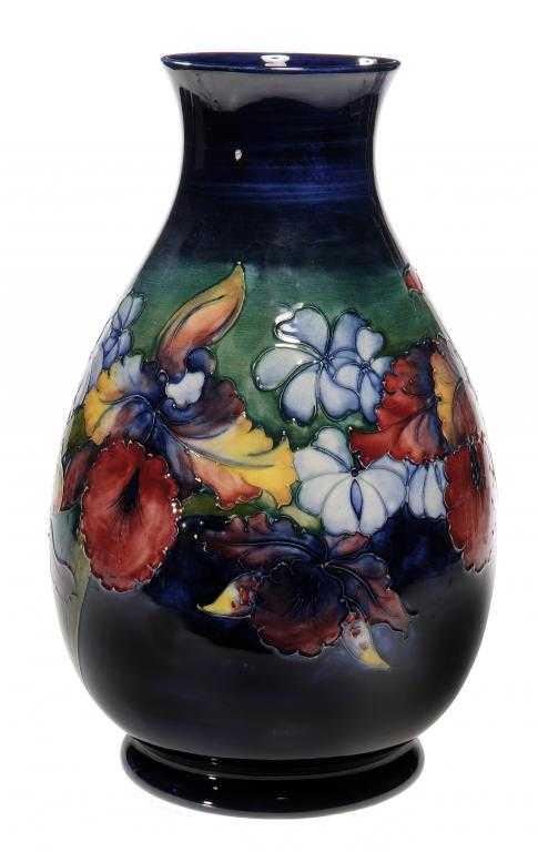 Appraisal: A MOORCROFT ORCHID VASE DESIGNED BY WALTER MOORCROFT cm h